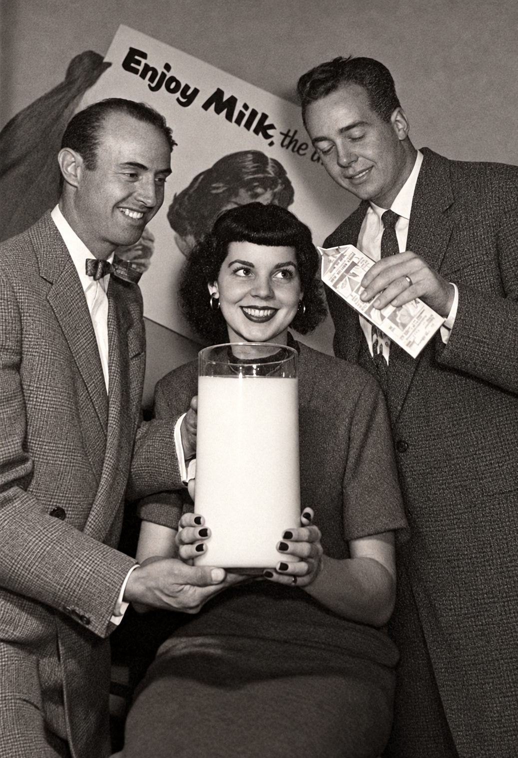 Vintage photo of a trio with an oversized milk glass, Dallas dairy history
